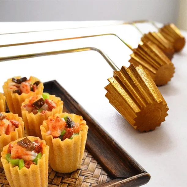 MX-SGC copper Deep-Fried Pie Tee Maker Molds next to finished golden-brown pastry shells filled with vegetables.