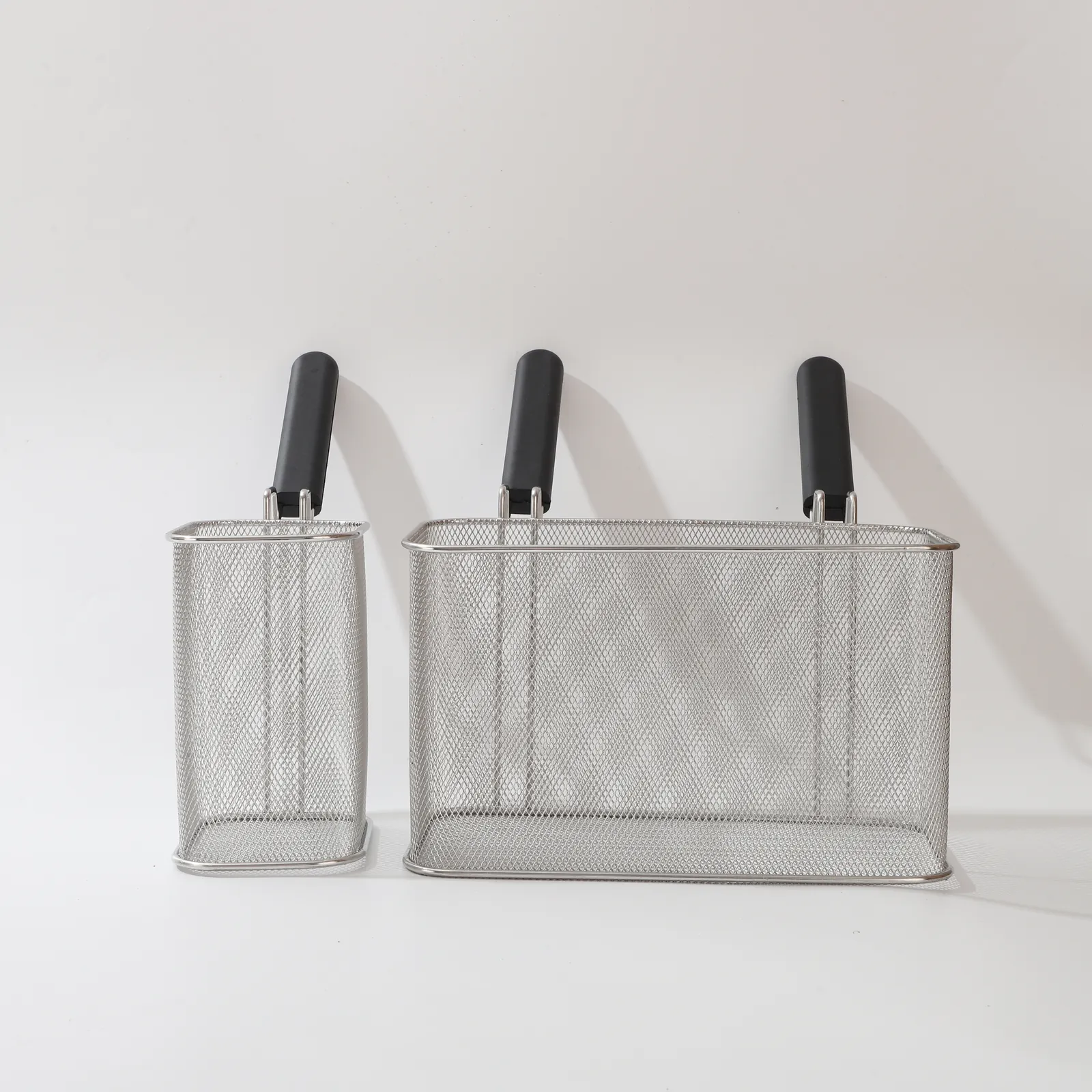 MX-FB02 two rectangular stainless steel wire mesh fry baskets with black handles, one narrow and one wide.